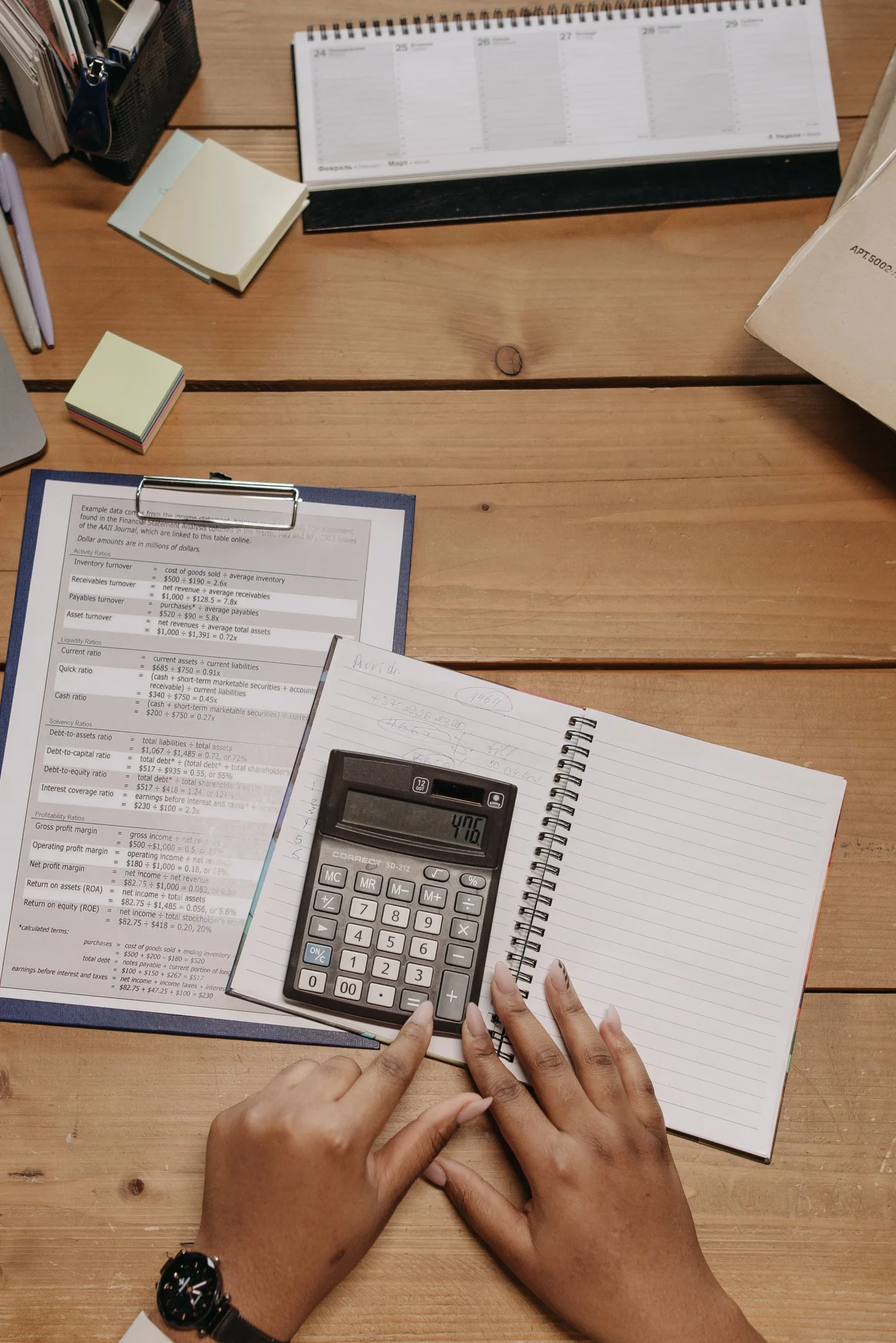 Reviewing documents with a calculator (illustrative)